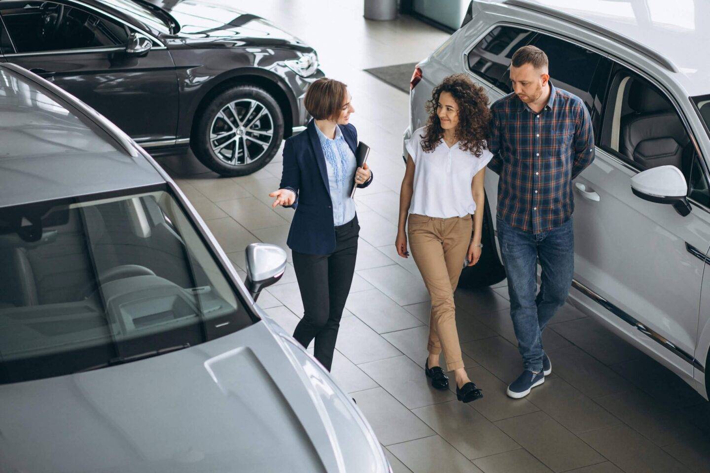 people looking at cars